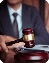 A judge's gavel striking its sound block